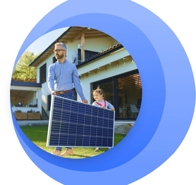 Man and child carrying solar panel